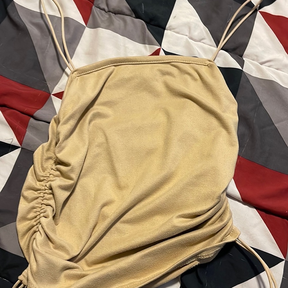 From forever 21 never worn size S in the color tan adjustable from the sides